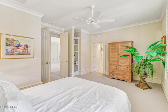 carpeted bedroom featuring ornamental molding, a ceiling fan, and baseboards