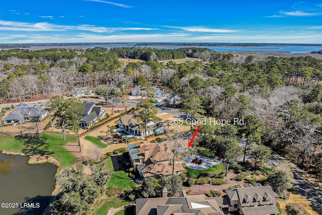 drone / aerial view featuring a water view and a residential view