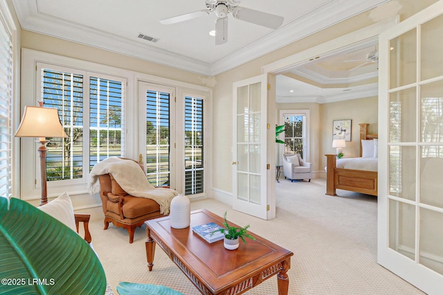 interior space featuring visible vents, crown molding, and french doors