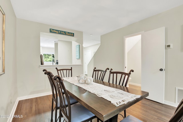 dining area featuring dark hardwood / wood-style floors