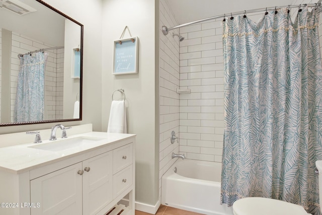 full bathroom with vanity, shower / bath combination with curtain, and toilet