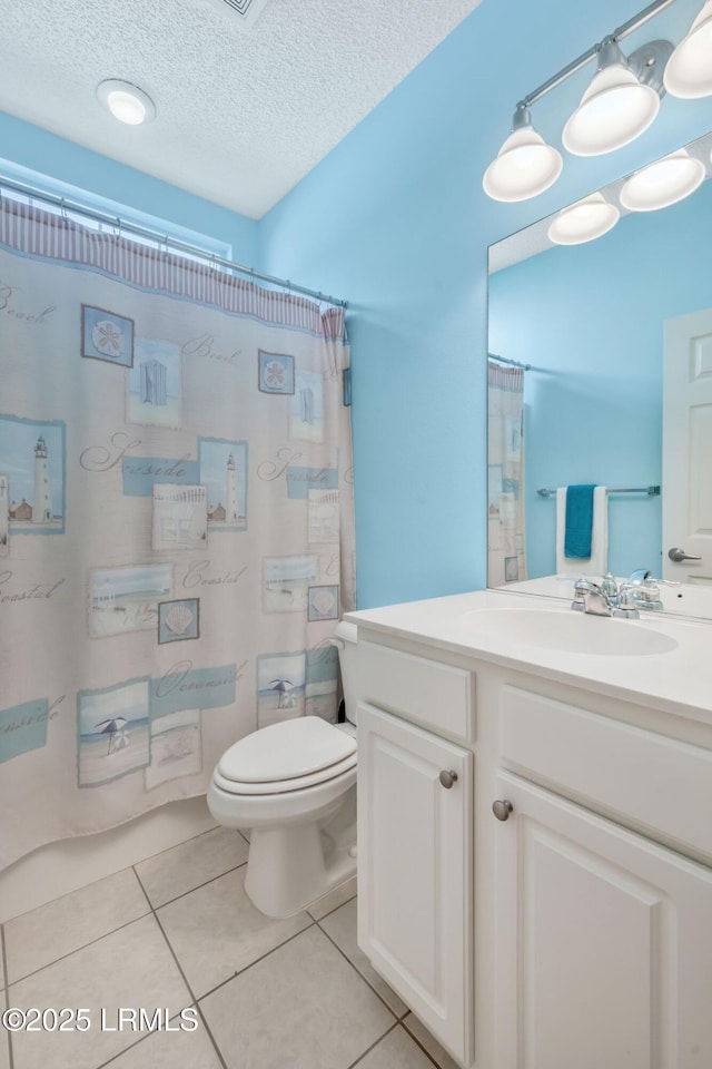 10 Cherry Ln, Okatie, SC 29909 - full bath with tile patterned floors, toilet, vanity, curtained shower, and a textured ceiling