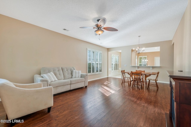 10 Cherry Ln, Okatie, SC 29909 - living room with ceiling fan with notable chandelier, visible vents, baseboards, a textured ceiling, and dark wood finished floors