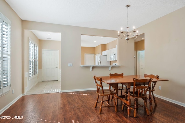 10 Cherry Ln, Okatie, SC 29909 - dining area featuring wood finished floors, a notable chandelier, and baseboards