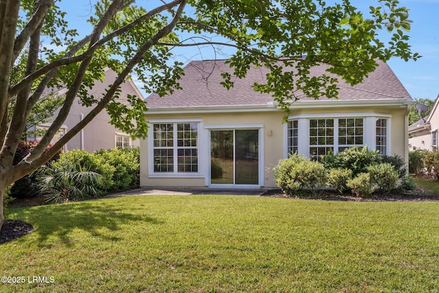 10 Cherry Ln, Okatie, SC 29909 - rear view of property featuring a shingled roof, a patio area, stucco siding, and a lawn