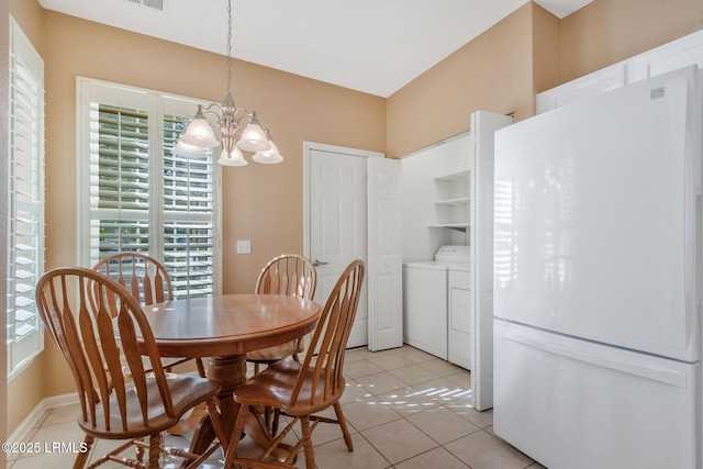 10 Cherry Ln, Okatie, SC 29909 - dining space featuring light tile patterned floors, visible vents, washer and clothes dryer, and a notable chandelier