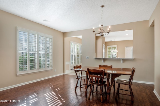 10 Cherry Ln, Okatie, SC 29909 - dining room with dark wood finished floors, a chandelier, and plenty of natural light