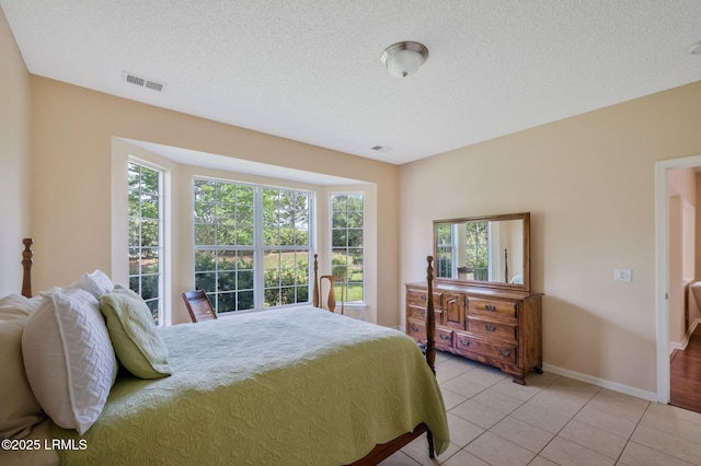 10 Cherry Ln, Okatie, SC 29909 - bedroom with light tile patterned floors, visible vents, multiple windows, and baseboards