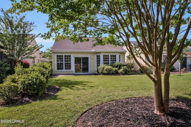 10 Cherry Ln, Okatie, SC 29909 - view of front of property featuring a front lawn, a shingled roof, and stucco siding