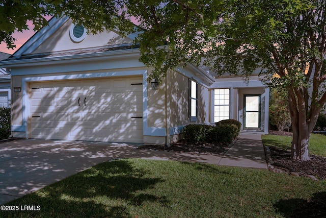 10 Cherry Ln, Okatie, SC 29909 - view of front facade featuring concrete driveway, a lawn, and an attached garage