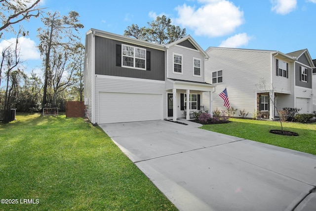 traditional-style home with a garage, concrete driveway, and a front lawn