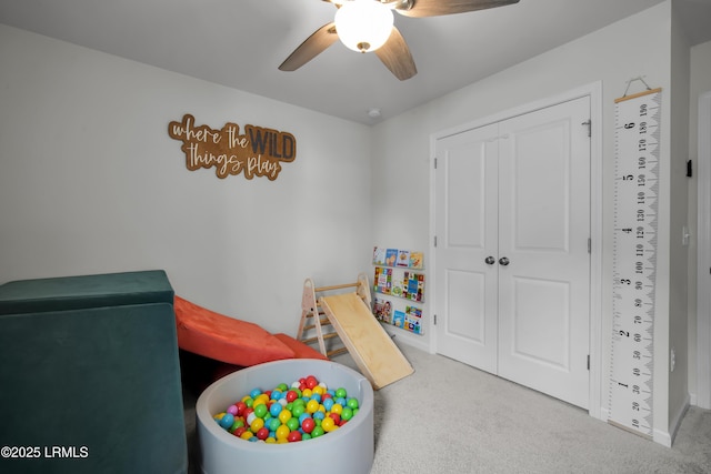 game room featuring carpet flooring and a ceiling fan