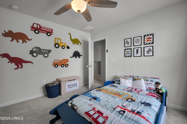 bedroom featuring carpet flooring, visible vents, a ceiling fan, and baseboards