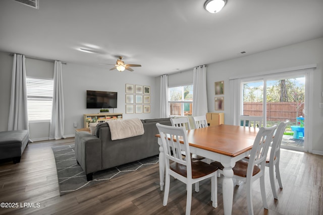 dining room featuring visible vents, wood finished floors, and a ceiling fan