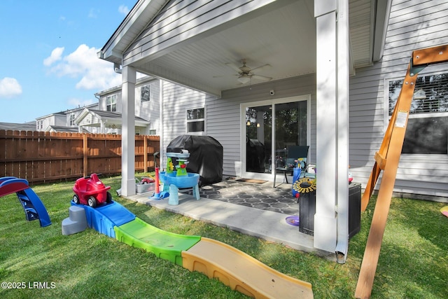 view of patio / terrace with grilling area, ceiling fan, and fence