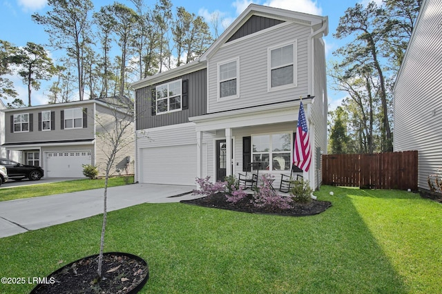 traditional-style home featuring fence, an attached garage, concrete driveway, a front lawn, and board and batten siding