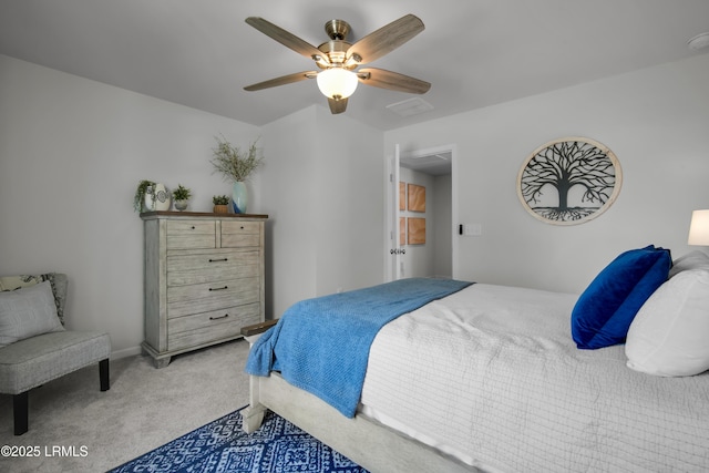 bedroom with ceiling fan and light carpet