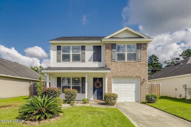 view of property with a garage and a front yard