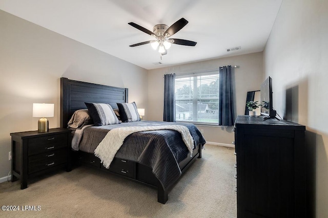 bedroom with light colored carpet and ceiling fan