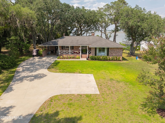 36 Stuart Town Ct, Beaufort, SC 29902 - single story home featuring a chimney, a front lawn, a porch, a carport, and brick siding