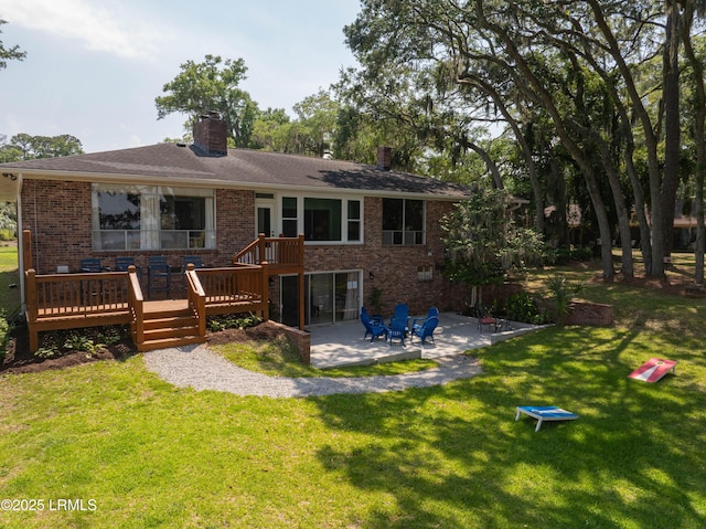 36 Stuart Town Ct, Beaufort, SC 29902 - back of property featuring brick siding, a chimney, a patio area, and a wooden deck