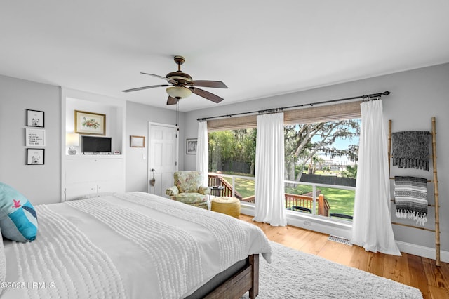 36 Stuart Town Ct, Beaufort, SC 29902 - bedroom featuring a ceiling fan, wood finished floors, and baseboards