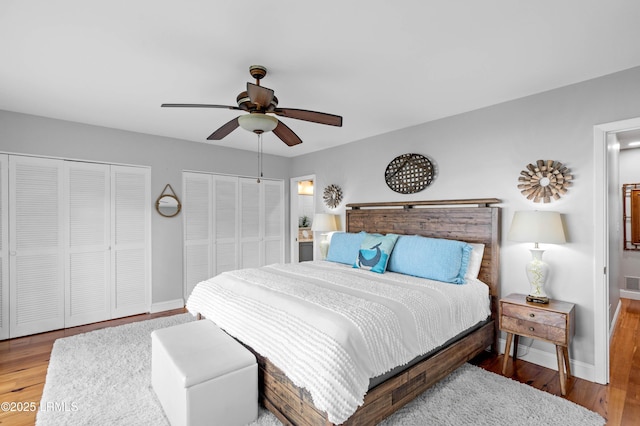 36 Stuart Town Ct, Beaufort, SC 29902 - bedroom featuring multiple closets, baseboards, and wood finished floors