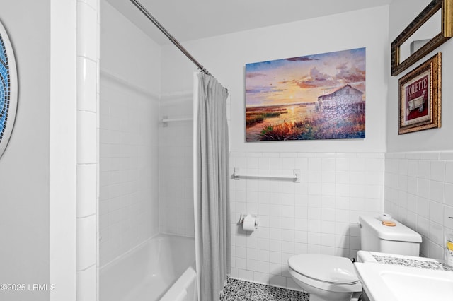 36 Stuart Town Ct, Beaufort, SC 29902 - bathroom with tile walls, toilet, shower / bathtub combination with curtain, a wainscoted wall, and a sink