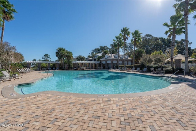 view of swimming pool with a patio area