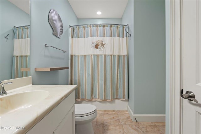 full bathroom with vanity, toilet, and shower / bath combo with shower curtain