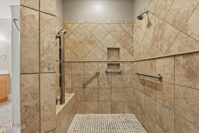 bathroom featuring a shower with door