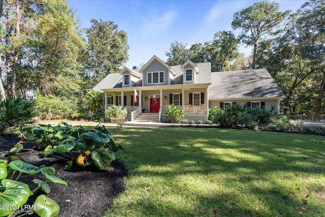 cape cod-style house featuring a front lawn and covered porch