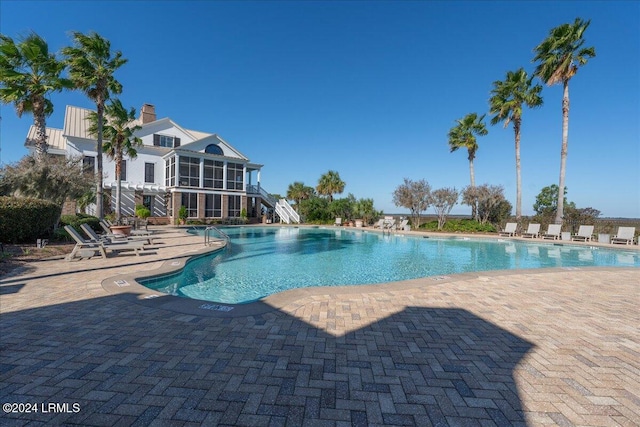 view of swimming pool with a pergola and a patio