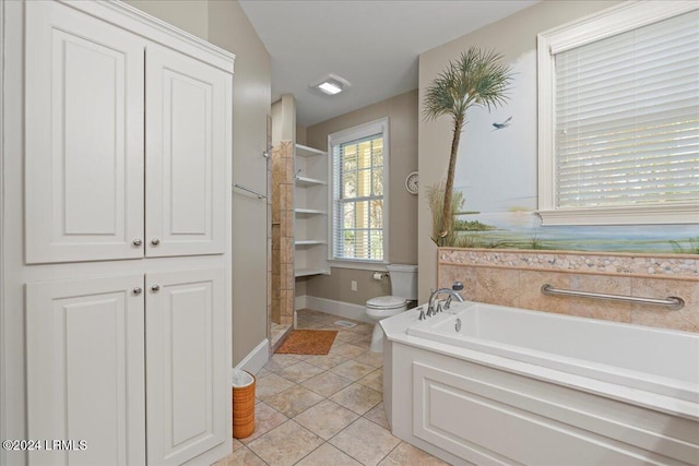 bathroom with tile patterned floors, toilet, and separate shower and tub