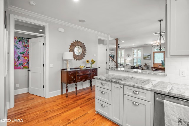 1108 12th St, Port Royal, SC 29935 - kitchen with stainless steel dishwasher, light wood finished floors, crown molding, a ceiling fan, and a peninsula