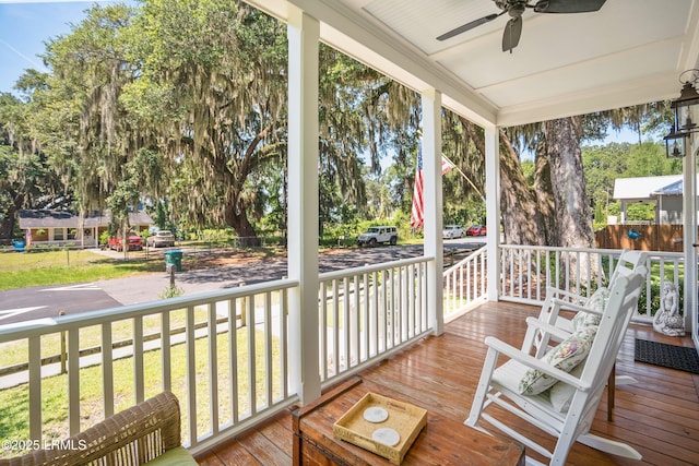 1108 12th St, Port Royal, SC 29935 - porch featuring ceiling fan and view of wooded area