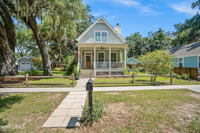1108 12th St, Port Royal, SC 29935 - view of front facade featuring a porch and a chimney