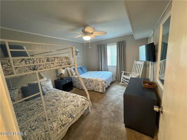 bedroom with crown molding, ceiling fan, and carpet flooring