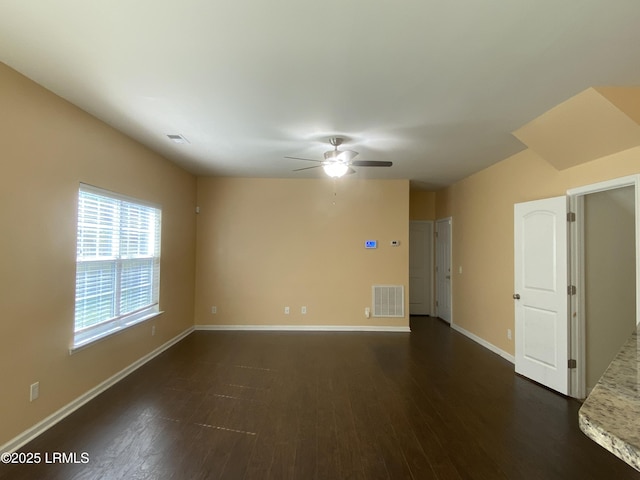 204 Mission Way, Beaufort, SC 29906 - spare room featuring dark wood-type flooring, a ceiling fan, and baseboards