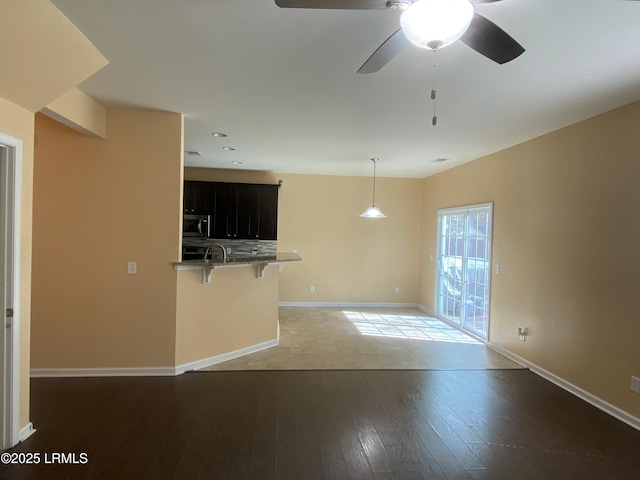 204 Mission Way, Beaufort, SC 29906 - unfurnished living room featuring wood finished floors, a ceiling fan, baseboards, and recessed lighting