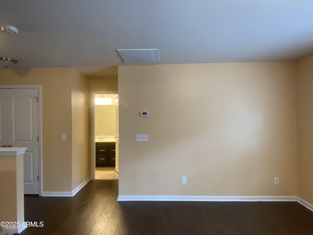 204 Mission Way, Beaufort, SC 29906 - empty room featuring dark wood finished floors, baseboards, and a smoke detector