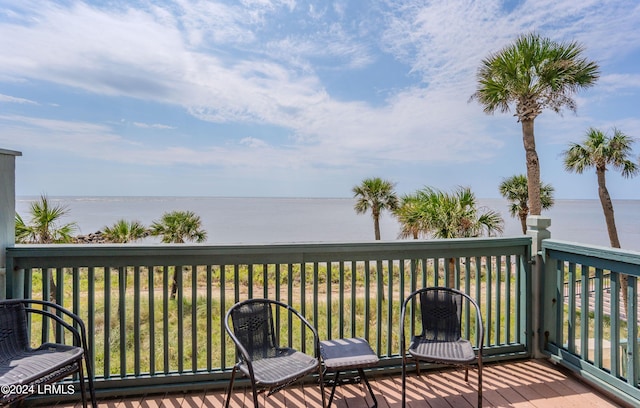 wooden terrace with a water view