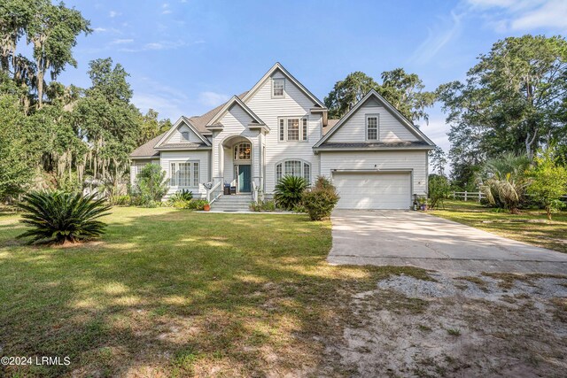 view of front of home featuring a garage and a front yard