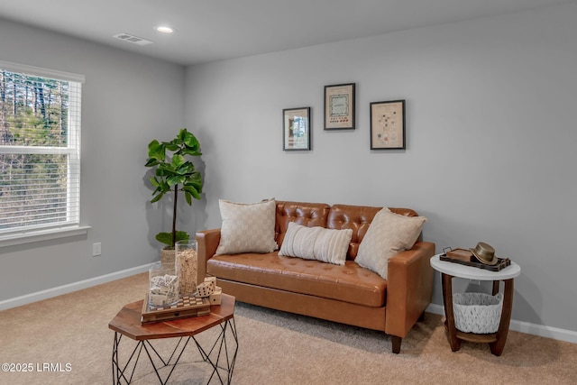 living area featuring light carpet, recessed lighting, visible vents, and baseboards