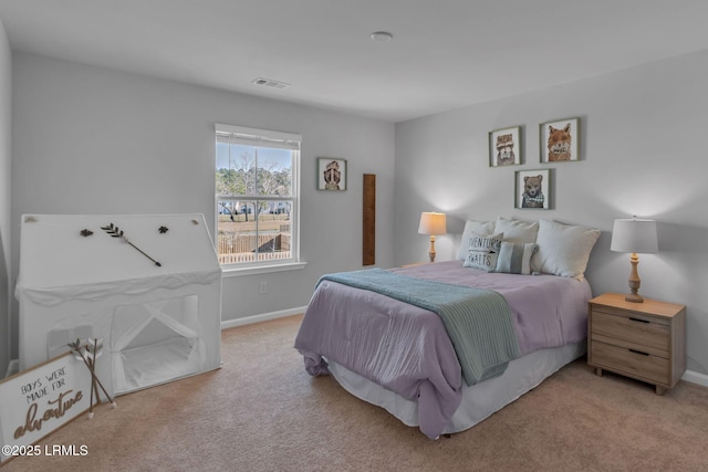 bedroom featuring light carpet, baseboards, and visible vents