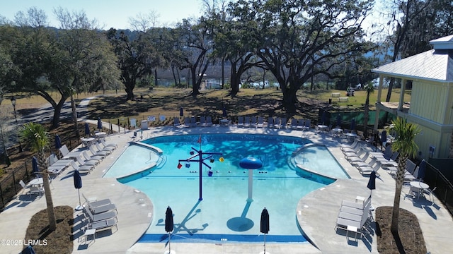 pool featuring a patio area and fence