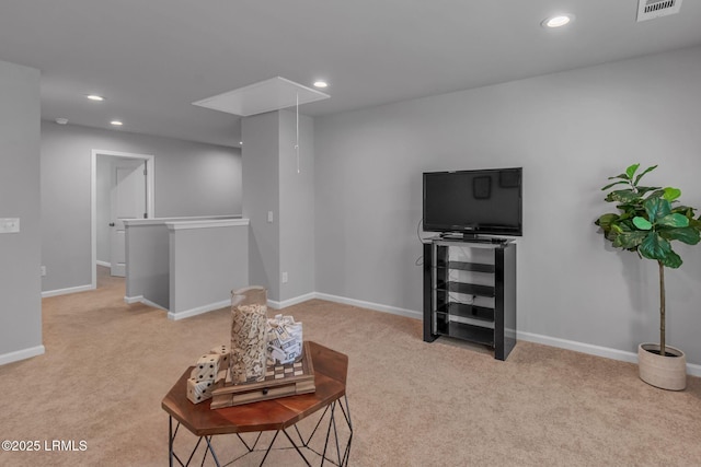 sitting room with recessed lighting, carpet flooring, visible vents, baseboards, and attic access