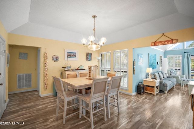 dining area with visible vents, wood finished floors, and baseboards