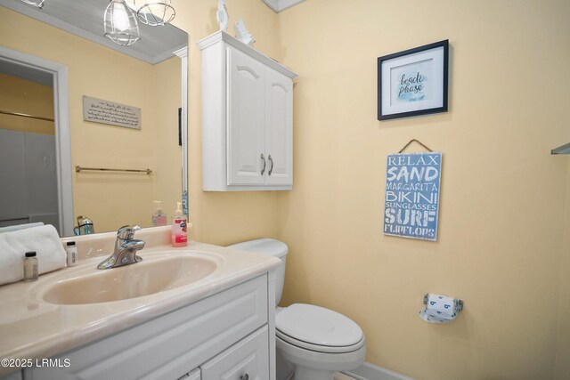 bathroom featuring toilet and vanity