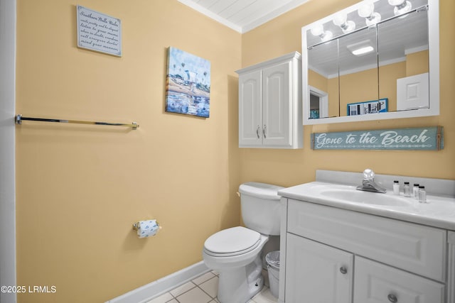 half bathroom featuring crown molding, baseboards, toilet, tile patterned floors, and vanity